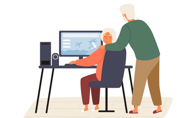 Eine ältere Frau und ein älterer Mann schauen sich Informationen auf einem Computer an.