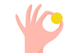 Eine Hand hält zwischen Zeigefinger und Daumen eine Münze.